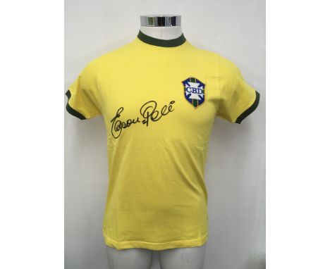 Pele Signed Brazil Football Shirt: Medium yellow replica retro shirt signed to front with full autograph. COA from reputable 