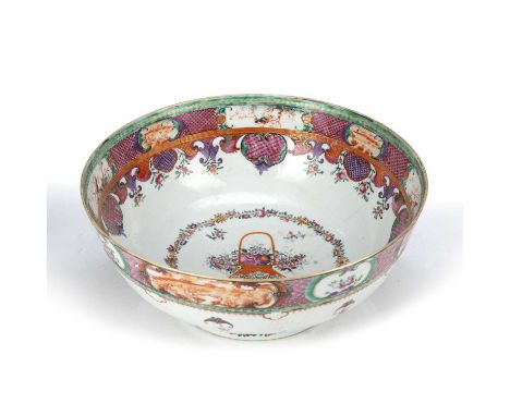 Famille rose bowlChinese, 18th Century, painted with a central vase of flowers, 28.5cm diameterCondition report: haircracks a