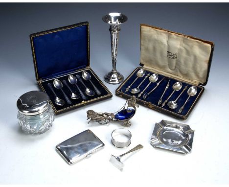 Group of silver piecesto include a cased set of six silver apostle top coffee spoons and tongs, a cased set of six coffee spo