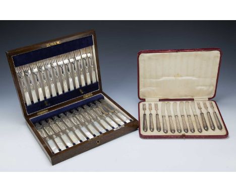 Two cased cutlery sets the first a Walker & Hall of Sheffield oak cased set with mother of pearl handles and a silver-handled