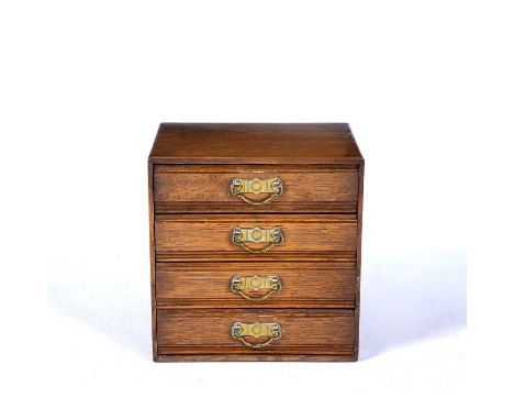 Oak tabletop chest of four drawersaesthetic movement, with brass handles, 30cm x 31cm x 25cmCondition report:Overall light we