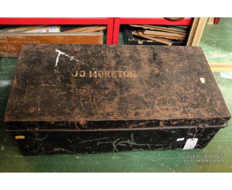 A vintage metal storage trunk