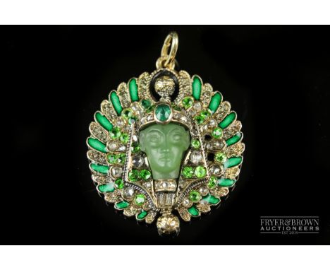 An Egyptian revival diamond and demantoid garnet gem set and enamel pendant, c1900, designed as an Egyptian pharaoh's head, t