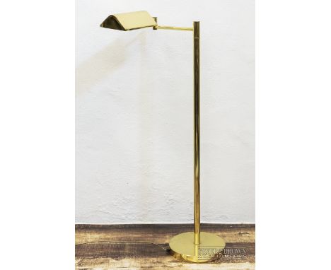 A gilt metal floor lamp