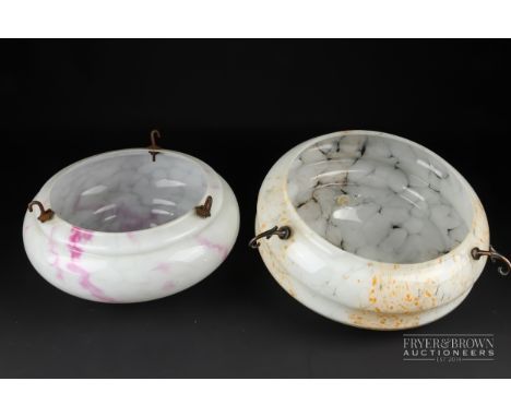 Two Art Deco glass suspended ceiling light shades, one white glass mottled with orange, 29.5cm diameter, the other with pink 