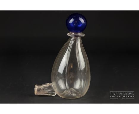 A blown glass bird drinking bottle, the ribbed pear shape bottle with blue ball finial, c1860, 14cm high