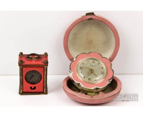 A miniature gilt metal carriage clock, c1900; and a 'Sheffield' metal and pink enamel alarm clock, c1940 (2)