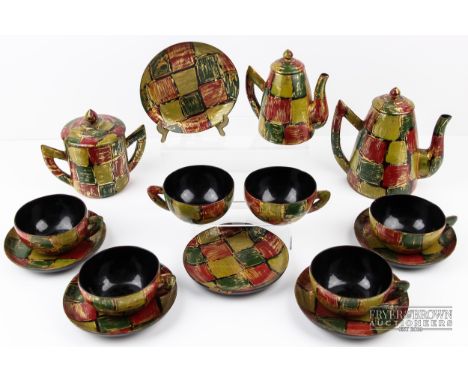 A Vietnamese lacquer tea and coffee service, patterned with brightly coloured checkerboard motif