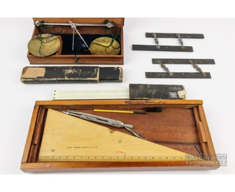 A boxed set of small hand held balance scales, with Troy marked weights; a boxwood Aston &amp; Mander set square with ordnanc
