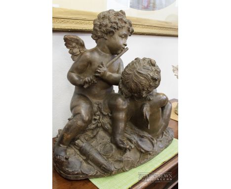 A large French terracotta figural group, signed Ferdinand Cian, of two putti, one playing a pipe, the other holding music, on