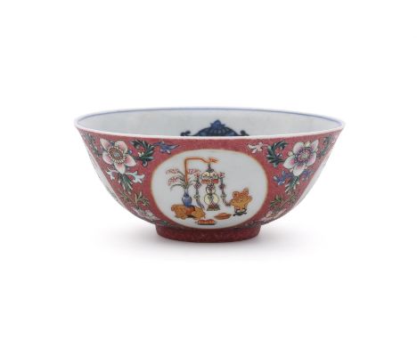 A Chinese famille rose ruby-ground scraffiato bowl, mark of Daoguang but early 20th century, painted and gilt to the exterior