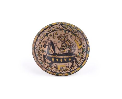 A Samanid polychrome buffware bowl, Persia, probably Nishapur, 10th century, underglaze brown, yellow and green painted earth
