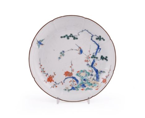 A Japanese Arita Porcelain Dish, of circular eight-lobed form resting on a short foot rim, decorated to the well in overglaze