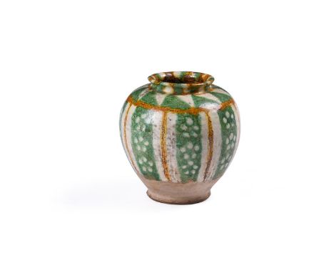 A Chinese Sancai pottery vase, the ovoid body with short flared neck, the glaze running down leaving the lower part and the b