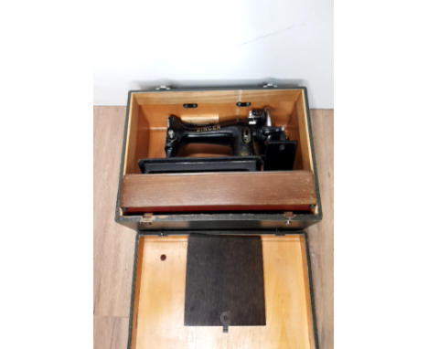 A VINTAGE SINGER SEWING MACHINE