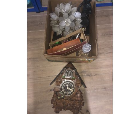 A BOX CONTAINING CLOCKS LAMP SHADES AND FIGURES ETC