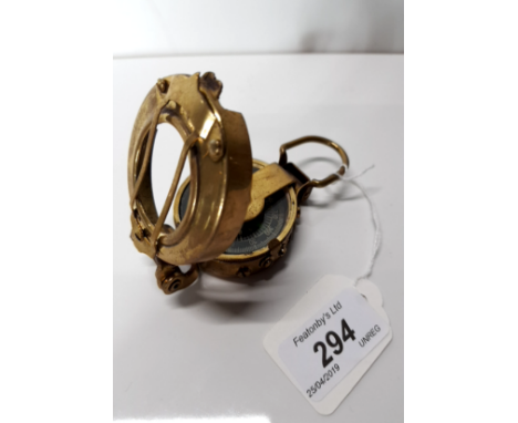 A VINTAGE BRASS POCKET COMPASS