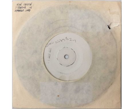 IRON MAIDEN - STRANGER IN A STRANGE LAND 7" (WHITE LABEL T/P - EMI 5589). A white label test pressing of Iron Maiden - Strang