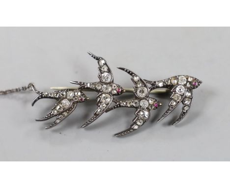 A Victorian yellow and white metal, cabochon ruby and old and rose cut diamond cluster set quadruple swallow brooch, with rep