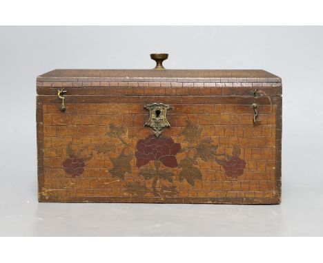 A late 19th century incised and painted tea caddy with floral brick decoration. 24cm wide