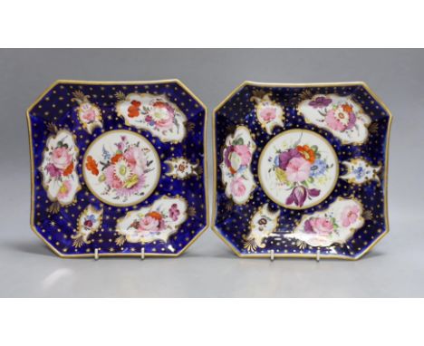 A pair of Coalport ground blue and gilt porcelain square dishes, c.1815-20, with floral panelled decoration. 22cm wide