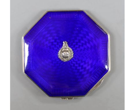 A George VI octagonal silver and blue enamel compact, with regimental appliqué, Birmingham, 1937, 80mm.