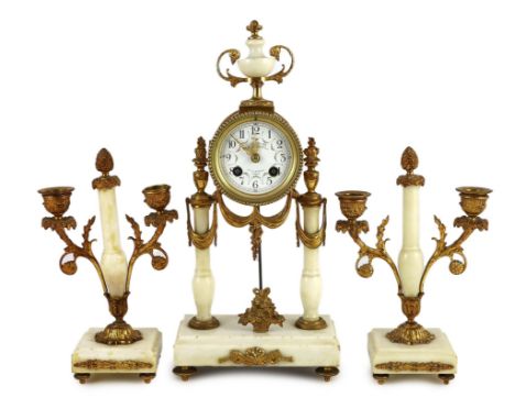 A Louis XVI style ormolu mounted white marble eight day mantel clock and a matching pair of twin branch candelabra. 38.5cm ta