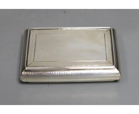 An early Victorian silver rectangular bombe shaped snuff box, by Nathaniel Mills, Birmingham, 1839, 83mm.