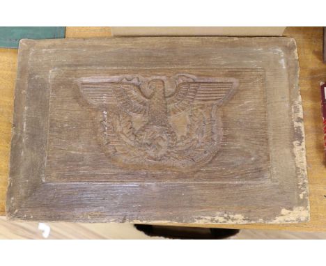 A 1930’s Third Reich carved oak fielded panel, 50cm wide