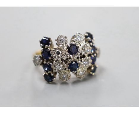 An 18ct, sapphire an diamond set cluster ring, size L/M, gross weight 6.5 grams.