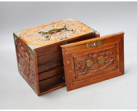 An early 20th century Chinese hardwood cased bone and bamboo mahjong set