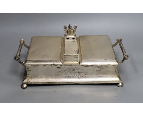 A George V silver mounted two handled desk top twin cigarette box incorporating a cigar cutter and lighters, with 1957 presen