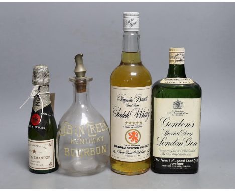 A bottle of (approx 70cl) Gordon's Special Dry London Gin, a bottle of 75cl Augustus Barnett Special Reserve Scotch Whisky, a