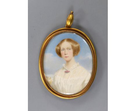 A yellow metal mounted oval portrait miniature of a young lady pendant miniature, the glazed back with plated hair beneath, 6