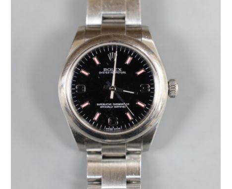 A lady's 2011 stainless steel Rolex Oyster Perpetual wrist watch, on a stainless steel Rolex bracelet, case diameter 31mm, wi