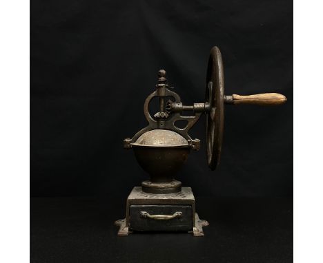 A C.1900 French iron table top coffee mill or grinder by Goldenberg &amp; Co. with maker's marks cast into the base. H.42cm