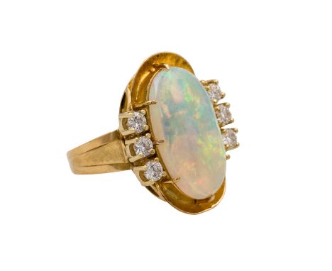   Ring mit ovalem Opal ca. 4,2 ct und 6 Brillanten zus. ca. 0,65 ct,   ca. WEISS (H)/VS, GG 18K, 6,9 g, RW: 58, 1960-70er Jah