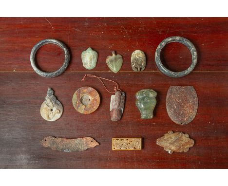 A GROUP OF ARCHAIC STYLE JADE CARVINGS
Including two bangles, a sword slide etc.
Largest bangle 8.5cm diameter
Condition: For