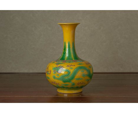 A YELLOW GROUND GREEN ENAMELLED VASE Decorated with two trailing five clawed dragons above crashing waves Apocryphal Kangxi s