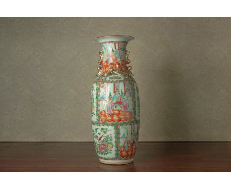 A CANTON FAMILLE ROSE BALUSTER VASE
First half of the 20th century
Decorated in the typical style with panels of figures, bir