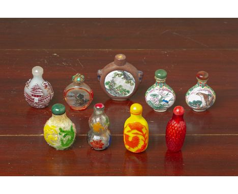 A GROUP OF ASSORTED SNUFF BOTTLES
Including various glass examples with overlaid decoration and two enamel examples
Largest 7