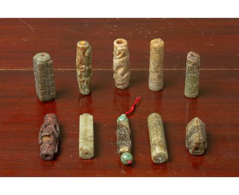 A GROUP OF TEN ARCHAIC STYLE CARVED JADE CYLINDRICAL TUBES Two of cong form, the others carved in shallow relief with archaic