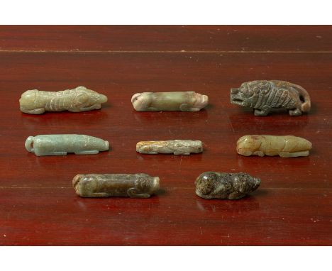 A GROUP OF EIGHT ARCHAIC STYLE JADE CARVINGS OF PIGS
Mostly modelled in a recumbent position
8.5cm long
Condition: For a cond