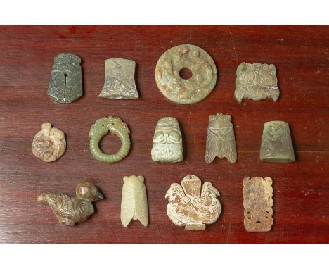 A GROUP OF ARCHAIC STYLE JADE CARVINGS
Including a disk, various pendants, on in the form of duck and cicada etc.
The disk 6c