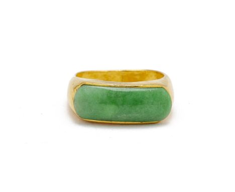 A JADE AND GOLD RING
The band of square shape, set with a rectangular panel of jade, marked .999 and Chinese character marks
