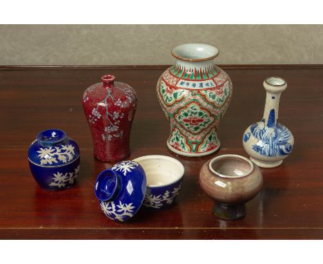 A GROUP OF ORIENTAL CERAMICS Comprising a pair of blue ground bowls and covers with foliate decoration, a prunus decorated fl