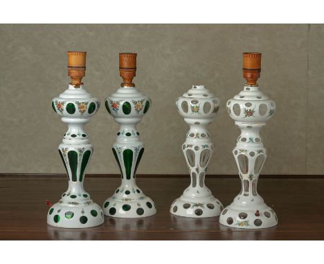 TWO PAIRS OF BOHEMIAN OPAQUE AND CLEAR GLASS LAMP BASES
With white overlay and green or clear glass, and foliate painted deco