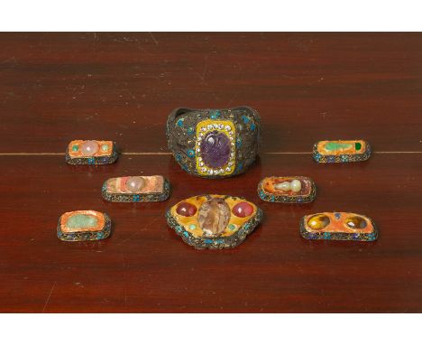A GROUP OF SILVER FILIGREE AND ENAMEL JEWELLERY
All later adapted
Comprising seven brooches and a large hinged bracelet, the 