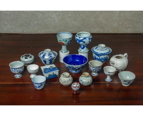 A GROUP OF SMALL BLUE AND WHITE AND OTHER CERAMIC ITEMS To include Ming style stem cups, a doucai example, two bowls and cove