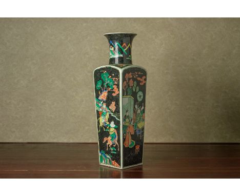 A FAMILLE NOIRE SQUARE SECTION VASE In the Kangxi style, the tapering body decorated with soldiers and court figures (conditi